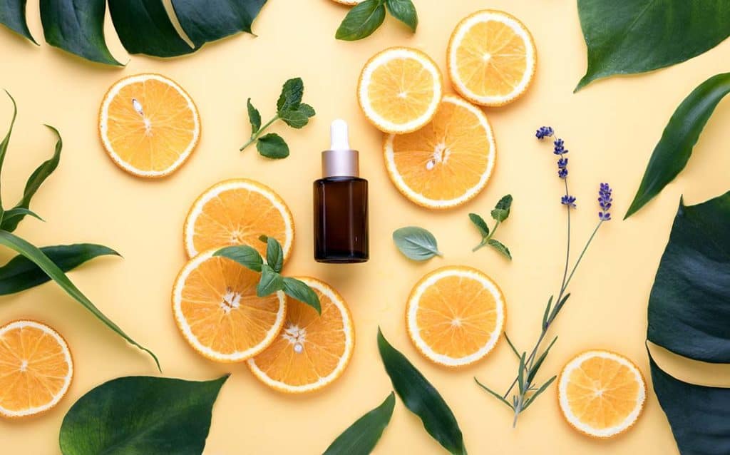 Show a bottle and images of orange to denote Vitamin C Serum