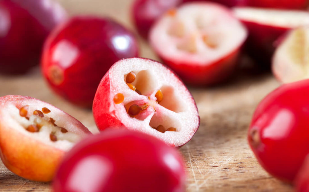 Sliced cranberries showing where cranberry seeds and cranberry seed oil comes from