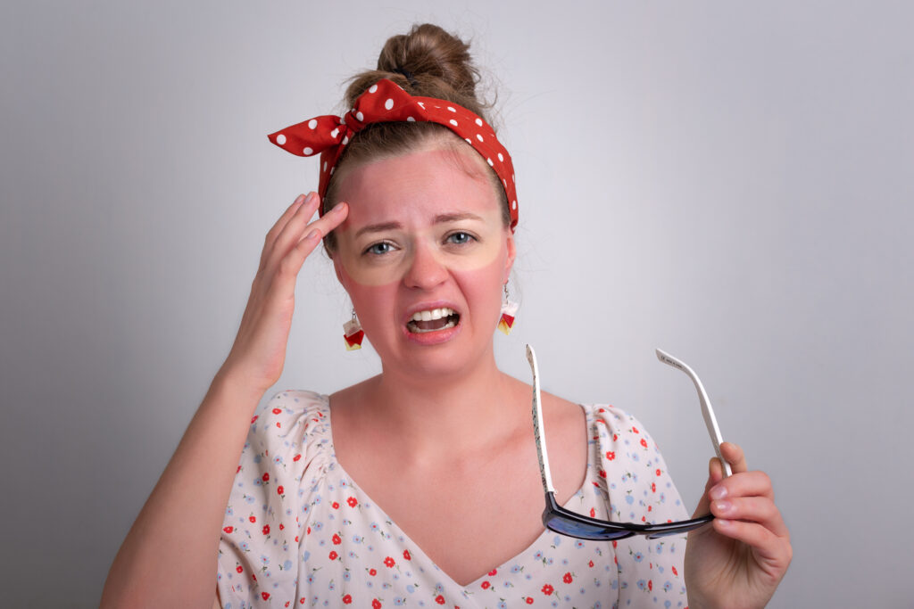 Woman with severe sunburn on her face.